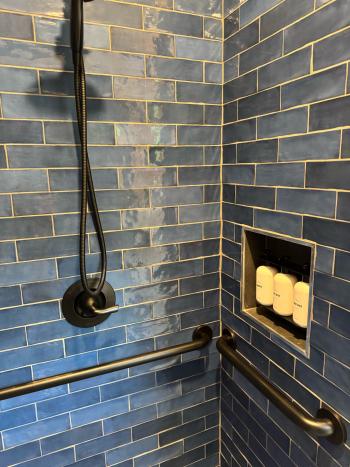 Blue glazed tile walk in shower completed.