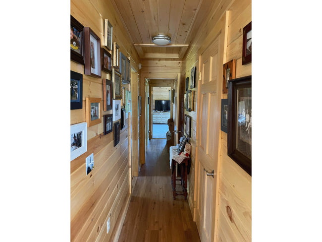 Hallway showcasing wood slat shiplap.