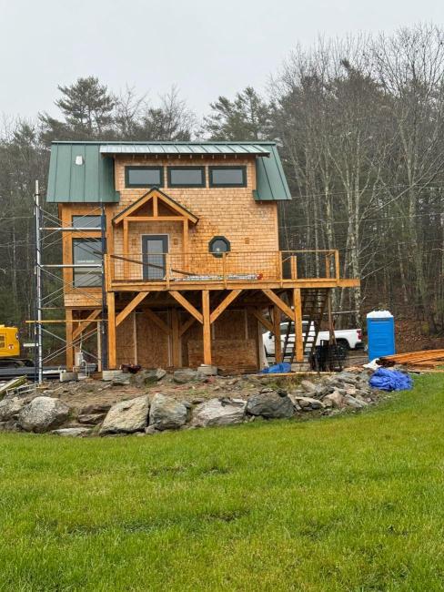 Ellsworth cabin set against a backdrop of trees