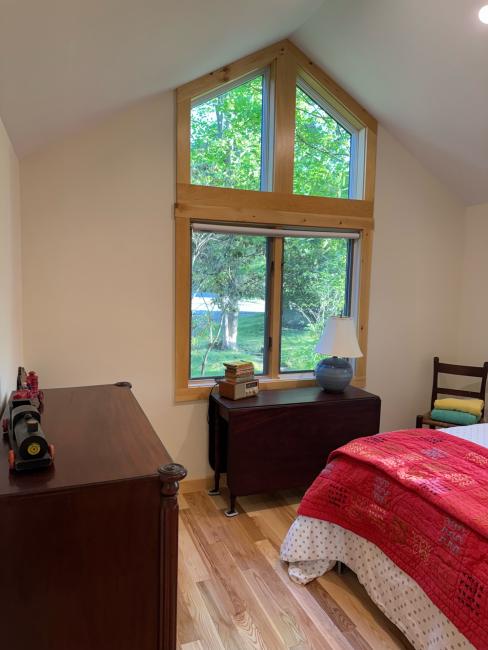 Cathedral window replacement with wood trim.