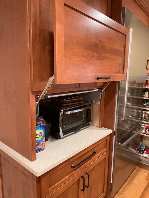 Open appliance garage to conceal toaster oven.