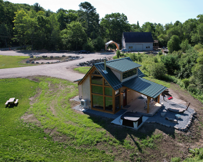Custom built cabin built near Ellsworth, Maine with additional cabin in the background.